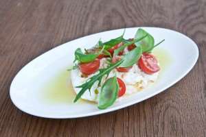 Burrata with tomatoes- La Serre Chef Izu Ani Interview Dubai